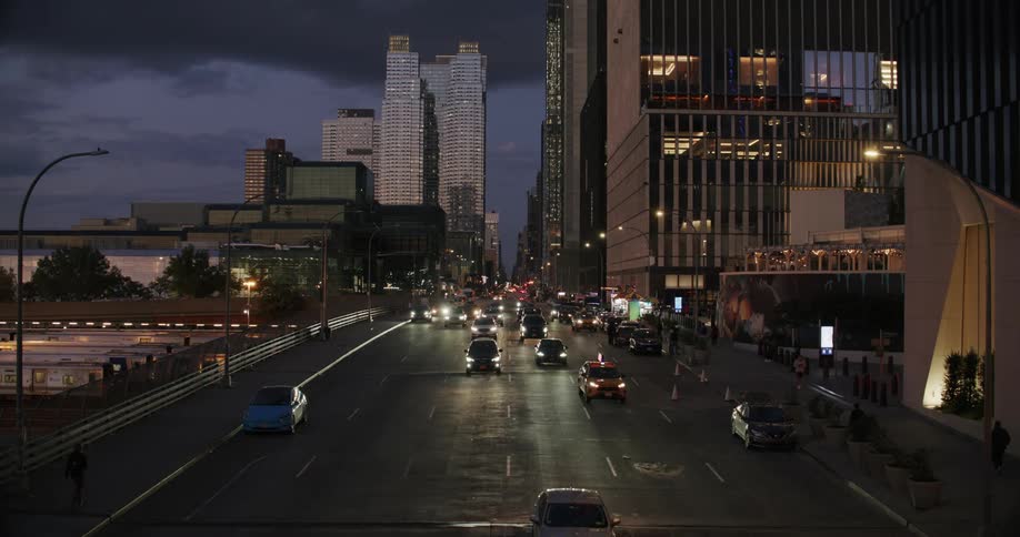 Panorama of a street in a metropolis at night with moving cars