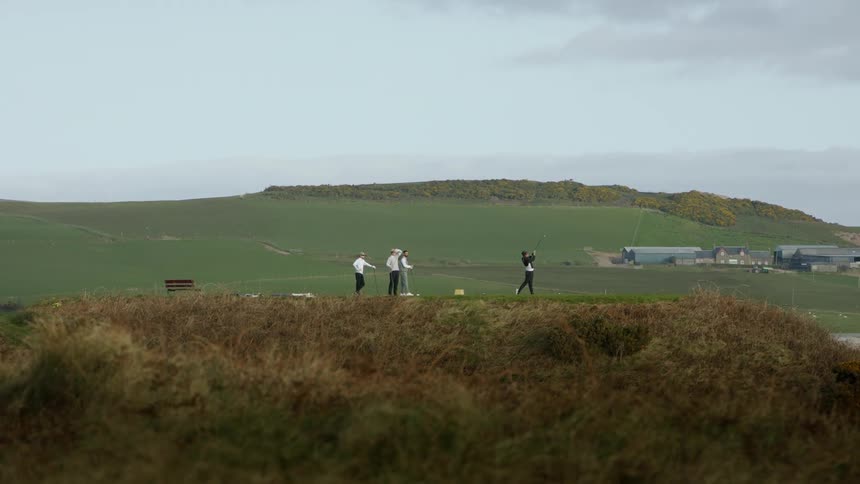 People playing golf on a golf course