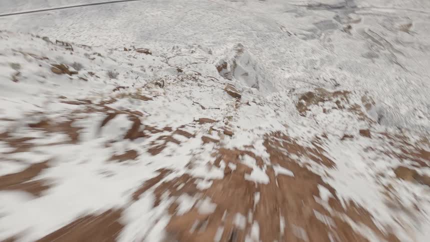 The mountains and landscape are covered with snow
