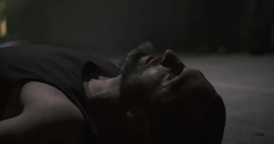 A man is lying still on the ground
