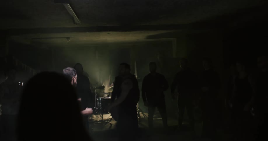 Two people begin fighting as others watch