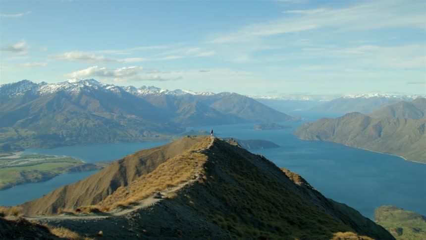 Mountains surround the water ahead