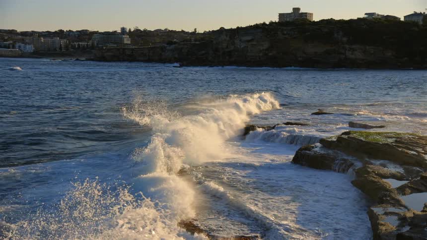 Waves crash against the shore