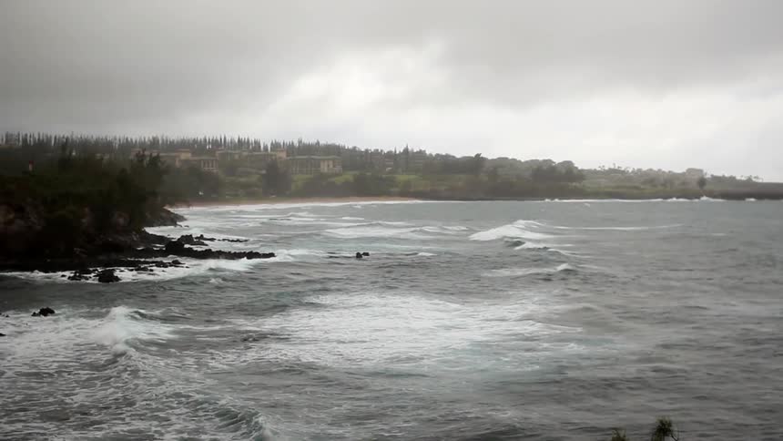Waves rolling on the water on a cloudy day