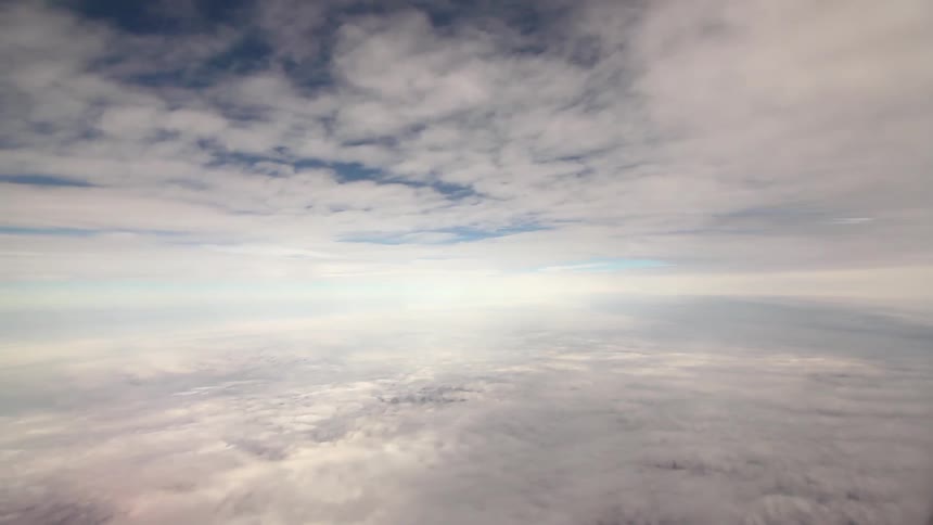 Clouds in the atmosphere with sun shining through them