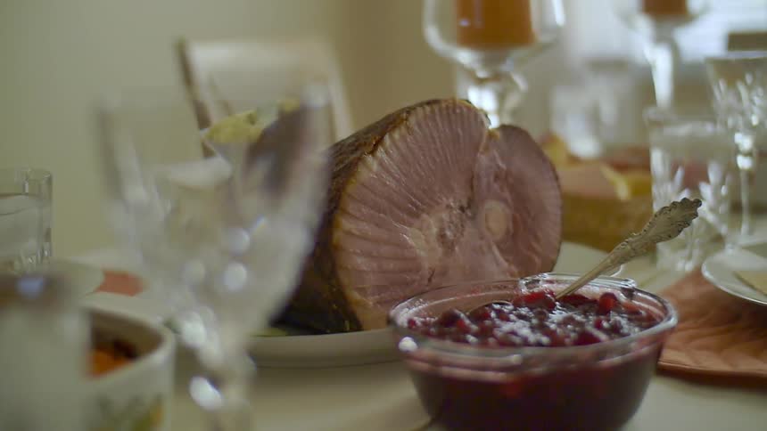 Food sits on a set table