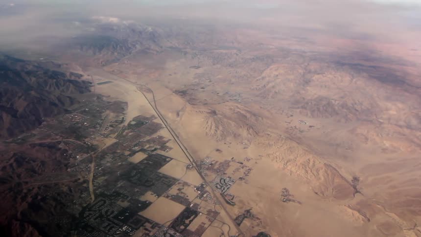A city in a desert near a mountain