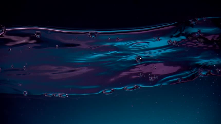 Neon art of gentle waves with bubbles in the water