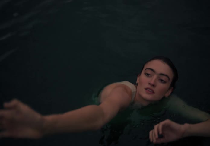 Lady dancing in the water during the day