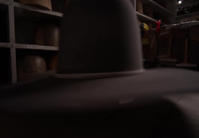 Cowboy hat spinning inside a workshop
