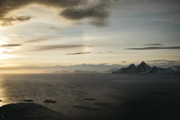 Time lapse of water flowing to the ocean next to the mountains