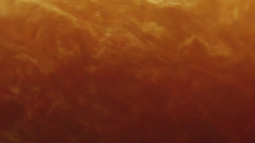 Abstract golden fluid in slow motion