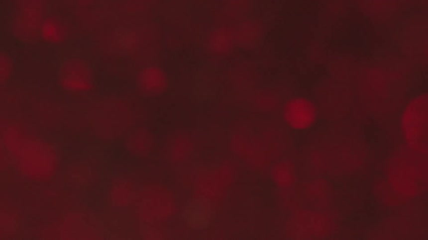 Red particles flowing in water