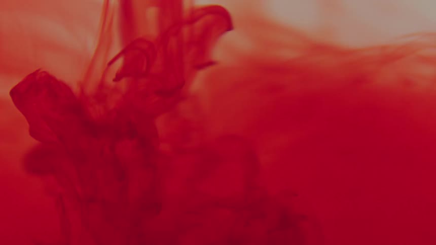 Absrtact art of bright red liquid ink flowing down