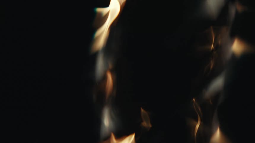 Extreme closeup of water with reflections of abstract lights spiraling and increasing speed in slow motion