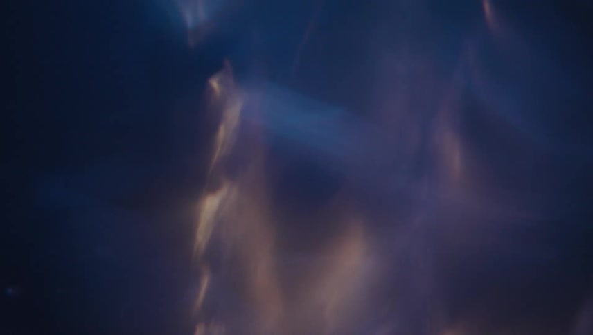 Extreme closeup of a spiral underwater gaining speed with reflections
