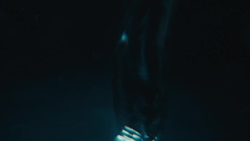 Close up of swirling clear water against a black background