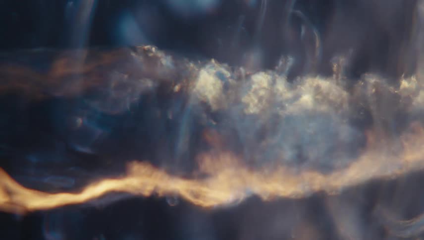 Extreme closeup of a spiral underwater with reflections