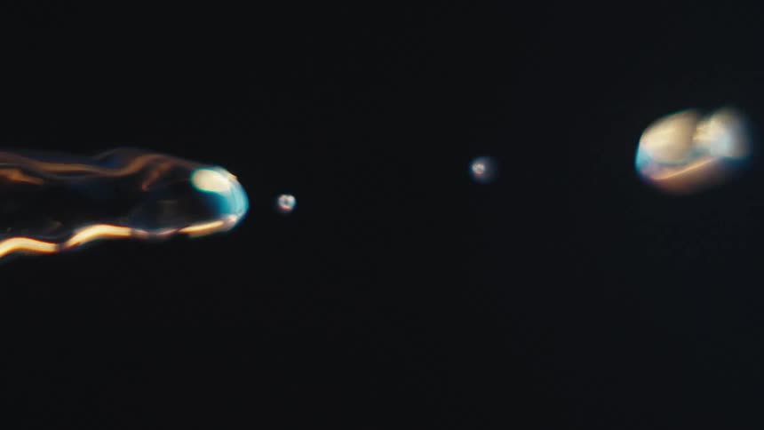 Close up of swirling clear water against a black background