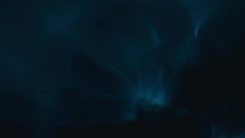 Closeup of a spiral underwater with reflections