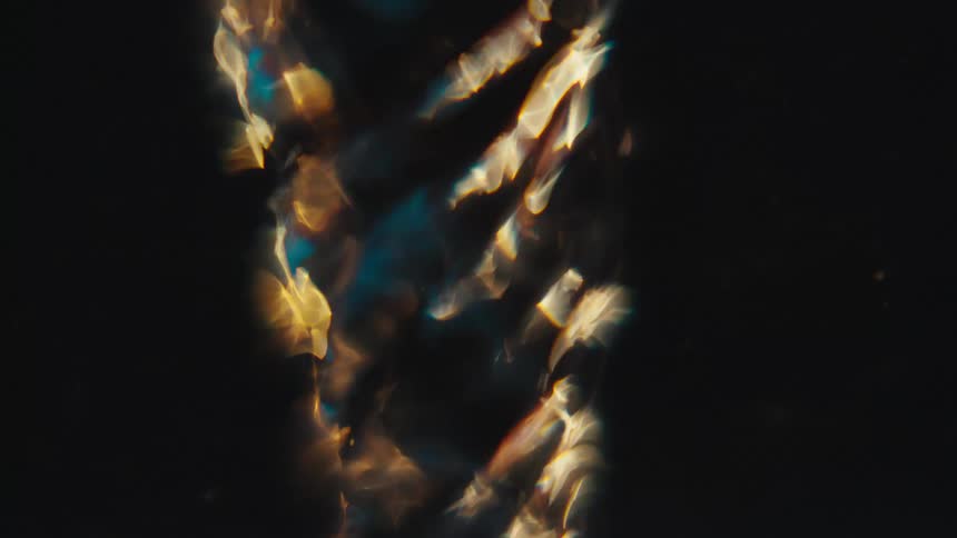 Extreme closeup of a spiral underwater dissolving
