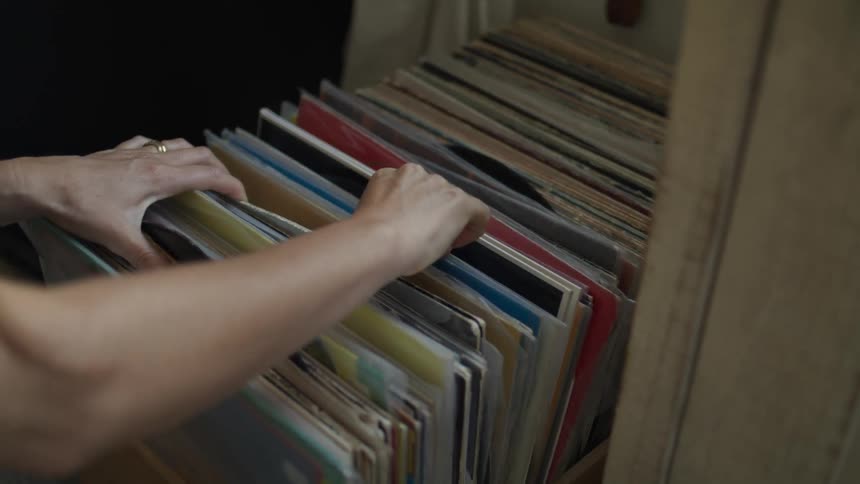 Lady brings out an old album after searching through its storage