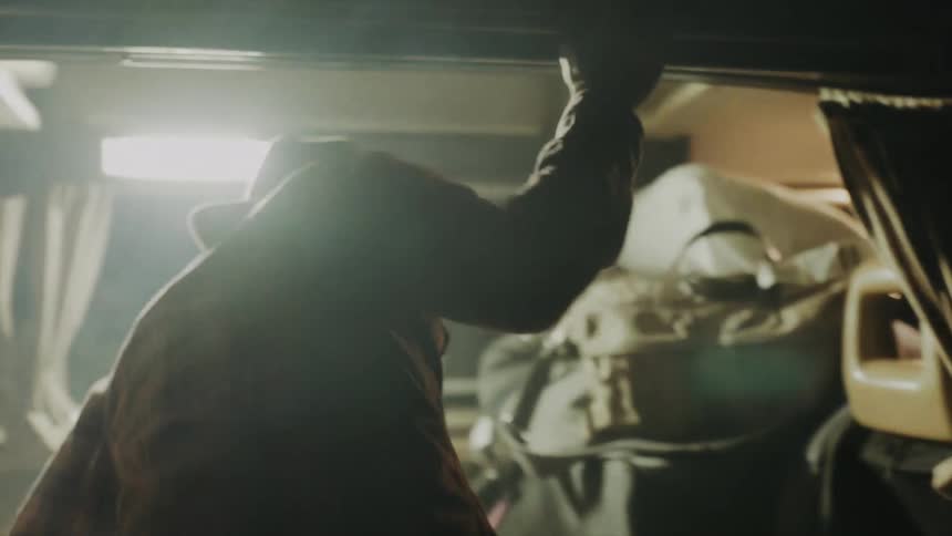 Mans back entering a vehicle