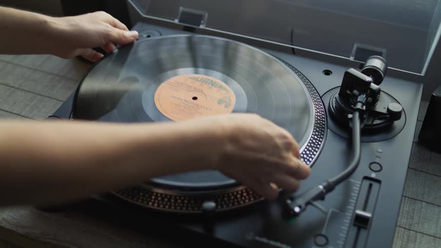 Vinyl record being placed on the music player