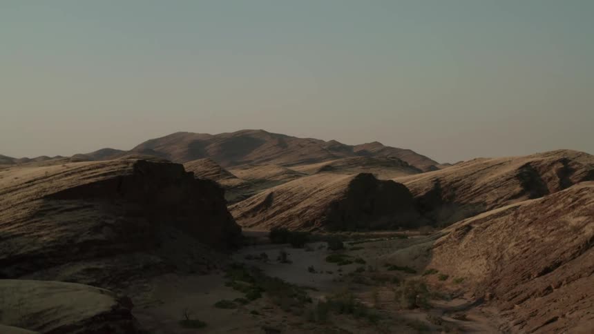 Aerial view of a desert landscape with mountains