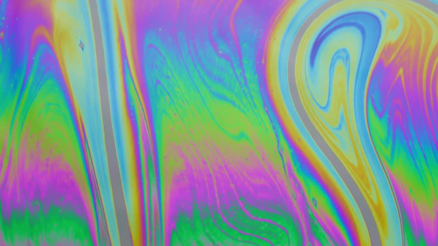 Pastel colors mix and blend as stripes swirl and bend into fluorescent colors