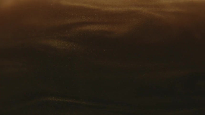 Dense and brown abstract smoke in slow motion