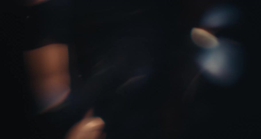 Abstract liquid in slow motion with reflections of lights