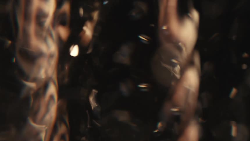 Close up of swirling clear water against a black background