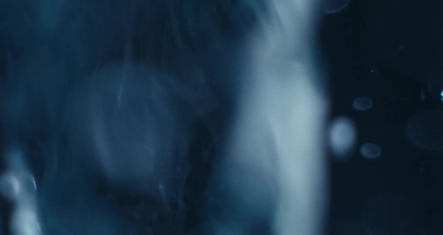 Extreme closeup of a rapidly moving and abstract spiral underwater