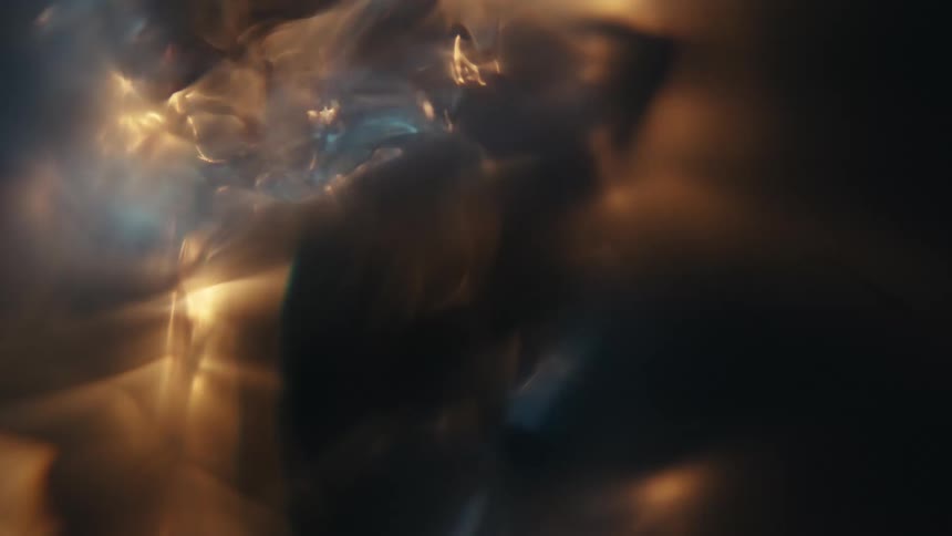 Extreme closeup of a spiral underwater with reflections