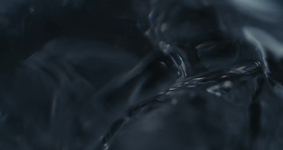 Close up of clear water swirling into a siphon