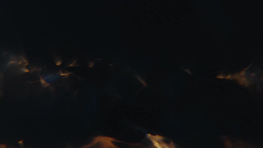 A tornado of fire and smoke glowing in the darkness