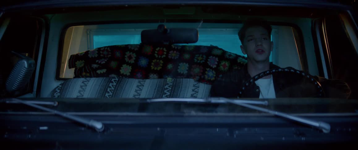 Portrait of a man sitting in the drivers seat