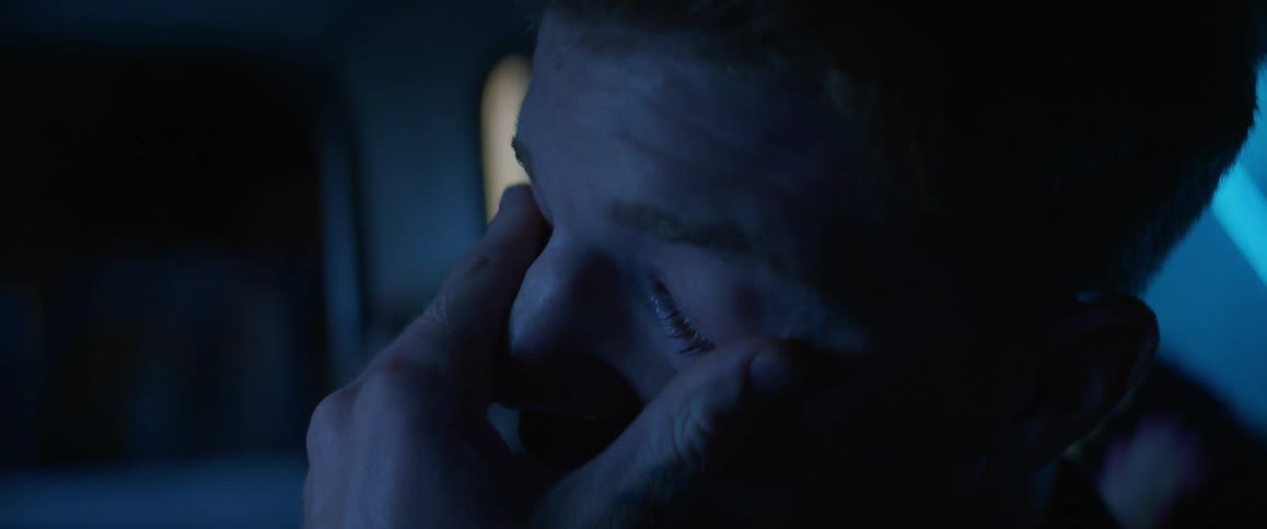 Portrait of a man crying inside the car