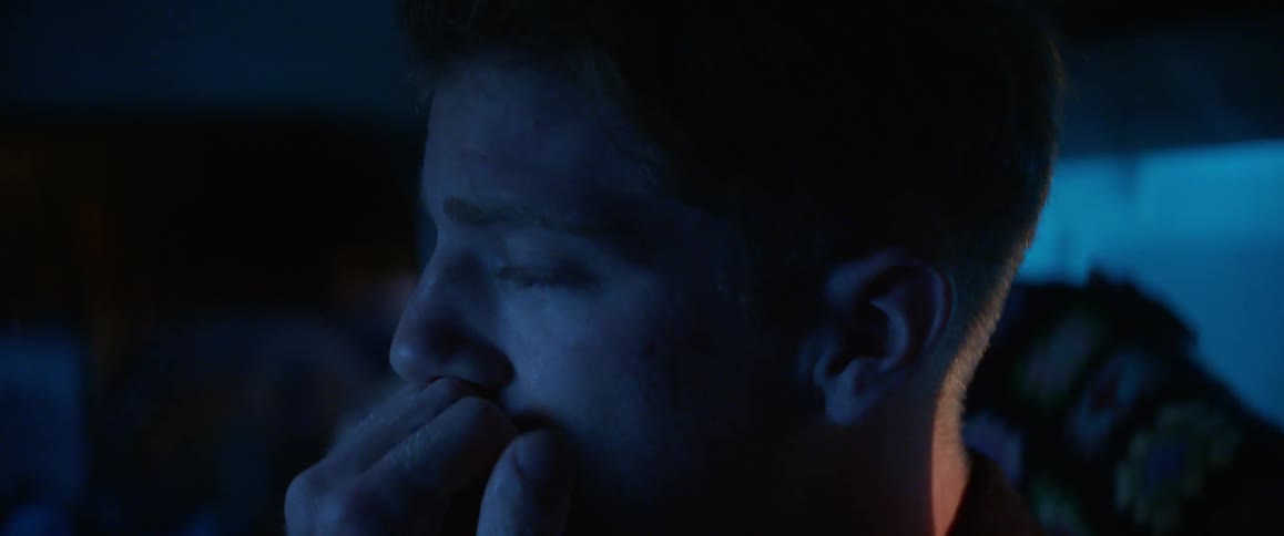 Portrait of a man with a facial expression of sadness and apprehension with one hand on his face