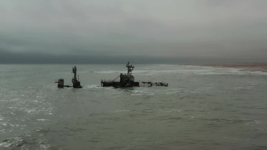 Aerial view of the wreck of a sunken ship near the coast