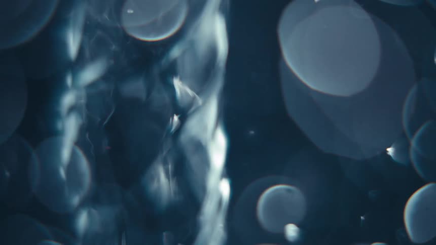 Close up of swirling clear water against a black background