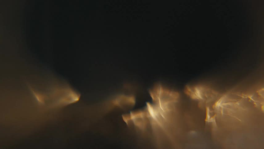 Underwater in fast and abstract motion with reflections of lights