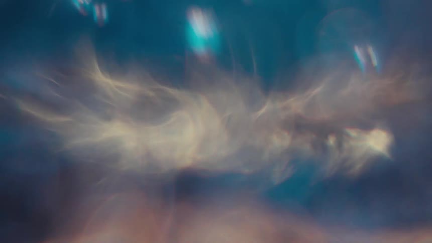 Water spins very quickly generating a bluish water funnel