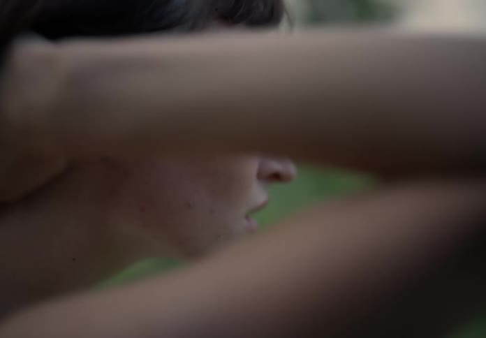 A dancing woman moves outdoors