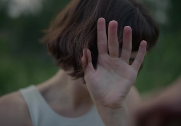 Closeup of a woman dancing in nature
