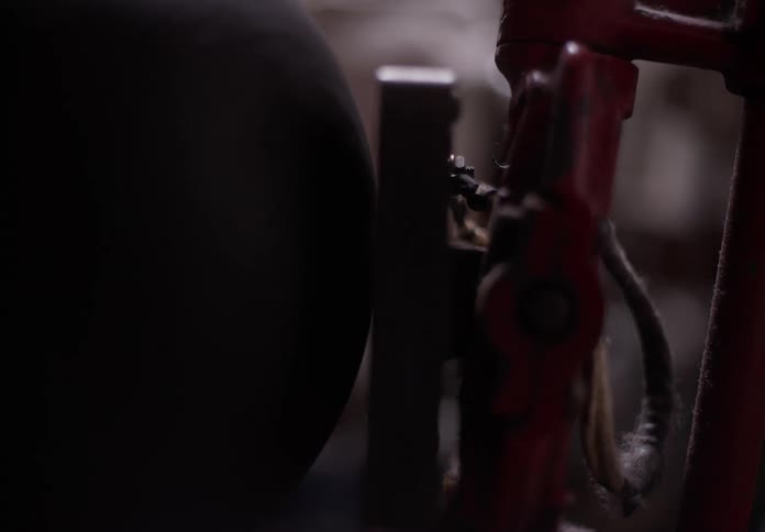 Abstract machine object in motion inside a dark room