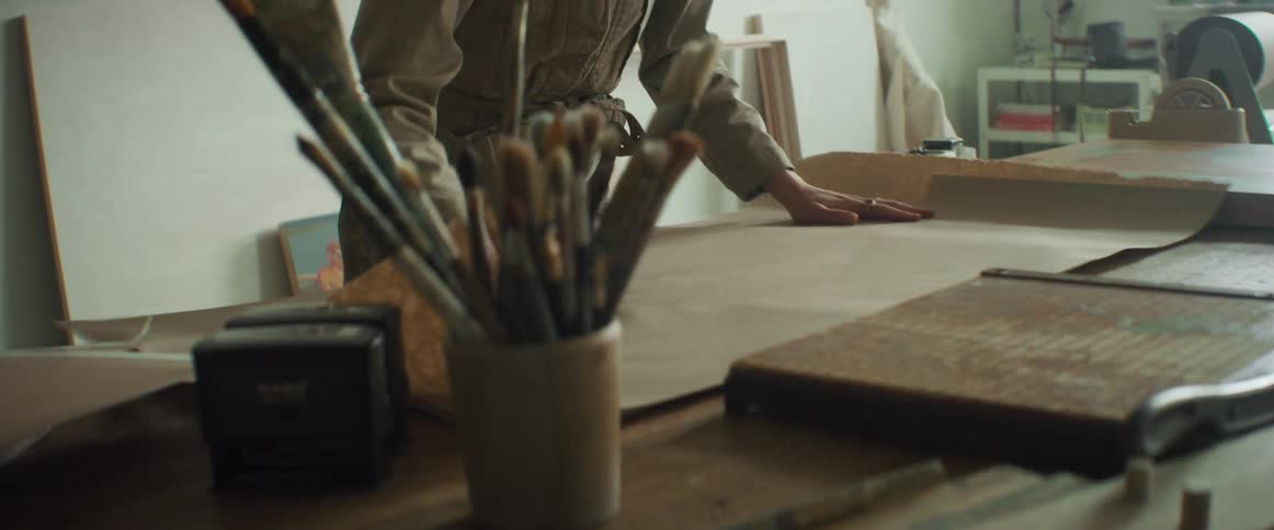 Artist packing a painting for shipping