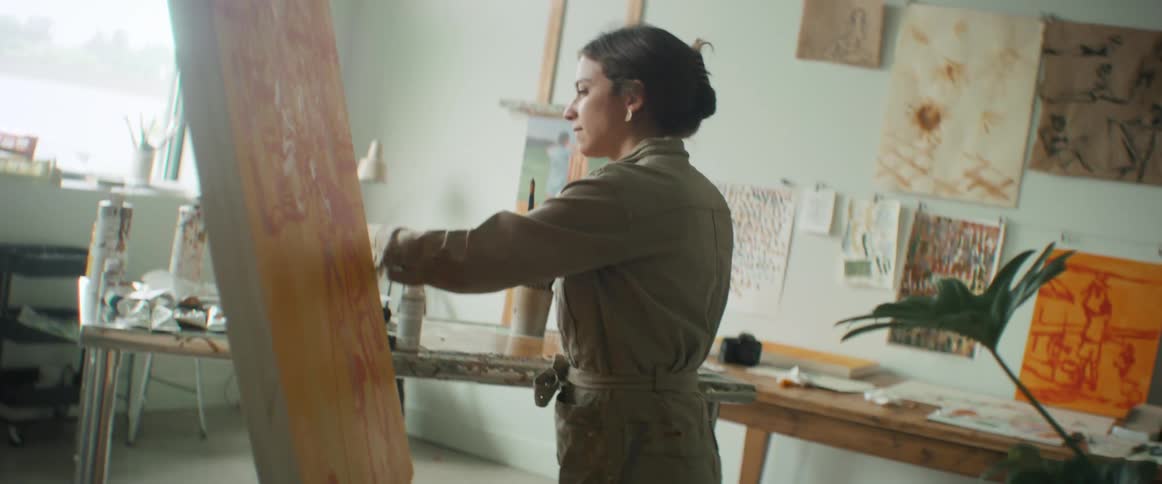 A female painter put down the palette in an art studio