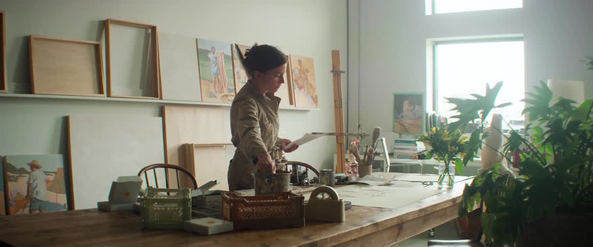 An artist painting in her studio